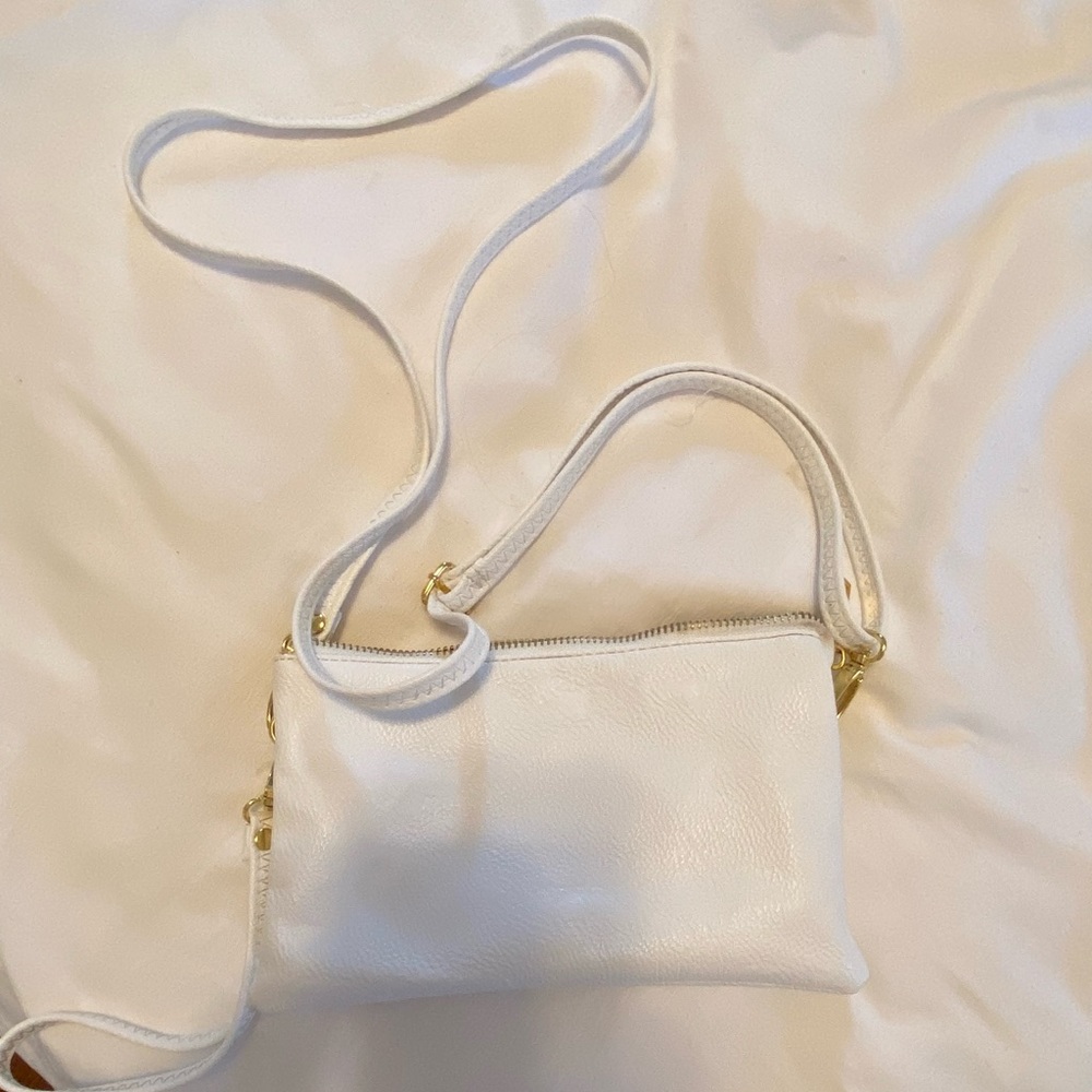 White purse with two interior pockets